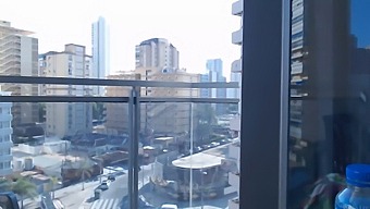 A Stunning Gamer Chick Flaunts Her Goods While Clothed On A Balcony Outside